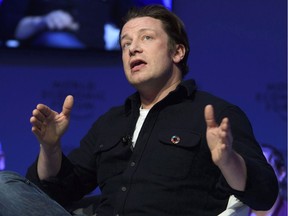 British Chef Jamie Oliver speaks at a panel session during the 47th annual meeting of the World Economic Forum in Davos, Switzerland, on Jan. 18. Oliver was urging a ban on selling energy drinks to kids, and wants to see the products regulated like cigarettes.