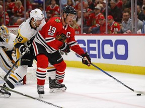 Chicago Blackhawks centre Jonathan Toews (right) controls the puck against the Pittsburgh Penguins on Oct. 5.