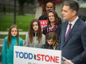 Todd Stone's wife, Chantelle, and their three children watch as Stone announces his bid for the leadership of the B.C. party. If anything, Chantelle Stone is rated as even smarter politically and more ambitious for the Liberals than her husband.