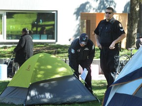 Vancouver police and park rangers issue tickets and orders to move along to campers at Oppenheimer Park in Oct. 2016.