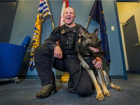 VANCOUVER, BC - OCTOBER 18, 2017 - VPD Officer Warren Butterman with Hawk at VPD Headquarters in Vancouver, B.C., October 18, 2017. Hawk is among the VPD canines that posed for the 2018 VPD charity calendar.