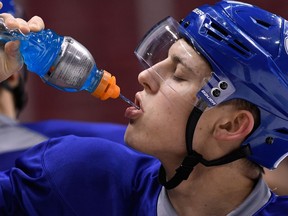 Vancouver Canucks Troy Stecher takes a drink during practice in Vancouver, BC, November, 29, 2016.