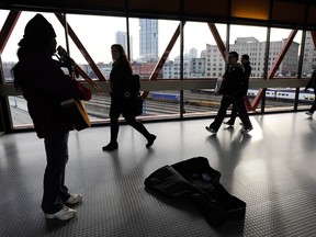 Alfredo Flores plays his pan flute and guitar at Waterfront Station in 2009.