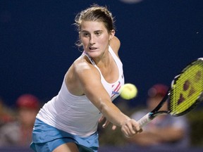 Rebecca Marino returns a shot against Ekaterina Makarova at the 2011 Rogers Cup in Toronto.