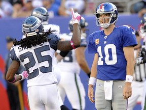 Seattle Seahawks defensive back Richard Sherman (25) and New York Giants quarterback Eli Manning (10) react after Manning threw an interception that was returned for a touchdown by Brandon Browner during the fourth quarter of an NFL football game in East Rutherford, N.J. Heading into their bye, the Seattle Seahawks had a good idea about the team they would be facing in a couple of weeks. The New York Giants were winless. One week changed everything and the Seahawks are going to see a much different opponent when they face the Giants at MetLife Stadium Sunday.