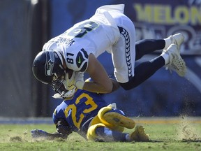 Seattle Seahawks tight end Nick Vannett top, is tackled by Los Angeles Rams cornerback Nickell Robey-Coleman during the second half of an NFL football game Sunday, Oct. 8, 2017, in Los Angeles. (AP Photo/Mark J. Terrill) ORG XMIT: CACC117
