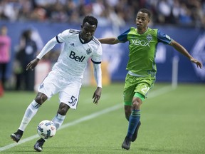 Nosa Igiebor, left, controls the ball in front of Jordy Delem.