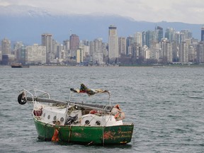 A derelict sailing boat is moored in English Bay off Jericho Beach at Vancouver in March 2010.