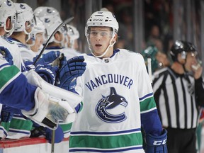 Jake Virtanen celebrates after scoring against the Wild.