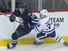 Winnipeg Jets forward Patrik Laine (left) battles Toronto Maple Leafs forward Auston Matthews on Oct. 19, 2016.