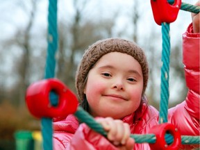 Lovely girl with Down Syndrome plays in a  playground. (PNG FILES)

Portrait of beautiful girl on the playground

Model and Property Released (MR&PR)
DenKuvaiev, Getty Images/iStockphoto