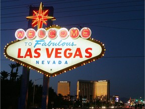 Traffic passes by the famous sign welcoming motorists on the south end of the Las Vegas Strip.