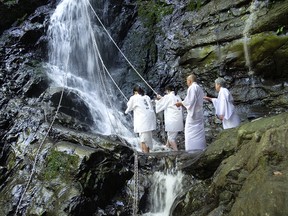 Making the climb for a waterfall blessing.