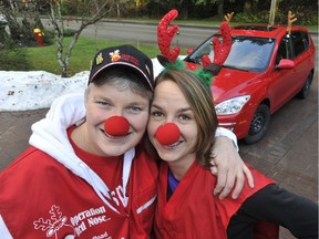 COQUITLAM, B.C.: DECEMBER 30, 2012 -- Volunteer drivers Lori Halcro, left, and Teri Towner, right, join "Rudy" in preparation for "Operation Red Nose", where free rides will be offered between 9 pm and 4 am New Year's Eve. They are from the Tricities area, where 80 volunteers will be available. This pic was taken in Coquitlam, December 30, 2012. (Stuart Davis / PNG) (for a story by Larissa Cahute, The Province) TRAX NUMBER 00017297A For story by SPORTS/The Province SPORTS/Vancouver Sun Stuart Davis, PROVINCE