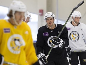 Sidney Crosby (centre) takes part in Pittsburgh Penguins' practice on Oct. 31, 2017, at Edmonton's Downtown Community Arena.