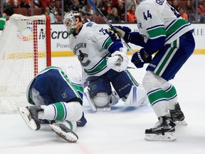 Logan Shaw is chased by Sam Gagner in the second period of Anaheim's 4-1 win over Vancouver Thursday night in California.