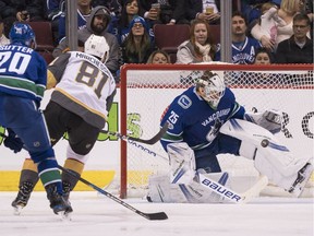 Goalie Jacob Markstrom stops Jonathan Marchessault in close at Rogers Arena.