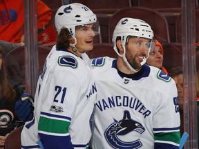 Canucks Loui Eriksson, left, and Sam Gagner were all smiles Tuesday as Vancouver beat the Flyers 5-2 at the Wells Fargo Center in Philadelphia. The Canucks will play in Pittsburgh Wednesday afternoon.