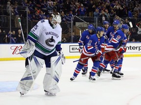 Jesper Fast of the New York Rangers celebrates his second period goal against Jacob Markstrom of the Vancouver Canucks at Madison Square Garden on November 26, 2017 in New York City.