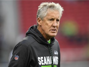 Head coach Pete Carroll of the Seattle Seahawks looks on while his team warms up prior to the start of their NFL football game against the San Francisco 49ers at Levi's Stadium on November 26, 2017 in Santa Clara, California.