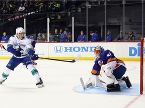 Jaroslav Halak makes the first period save on Bo Horvat, who would later score for the Canucks.