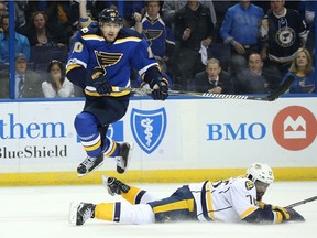 Scottie Upshall of the St. Louis Blues jumps over P.K. Subban of the Nashville Predators in Game 5 of the Western Conference Second Round playoffs last season.