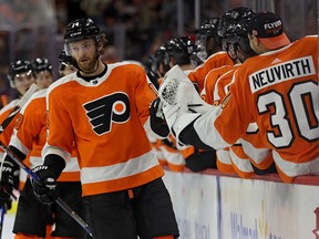 Sean Couturier #14 of the Philadelphia Flyers celebrates with teammates after scoring a goal against the Anaheim Ducks during the first period at Wells Fargo Center on October 24, 2017 in Philadelphia, Pennsylvania.