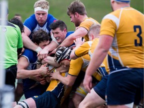 James Carson, with tape around his head, was named player of the game in UBC's 32-17 win over UVic in the gold-medal game at the Rugby Canada National University Championships last Sunday.