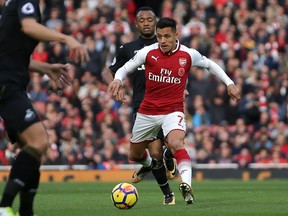 Arsenal's Chilean striker Alexis Sanchez runs with the ball during an English Premier League match between Arsenal and Swansea City at Emirates Stadium in London on Oct. 28.