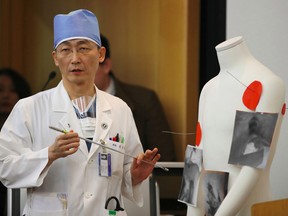 South Korean doctor Lee Cook-Jong, who carried out surgery on gunshot wounds sustained by a North Korean soldier, speaks about the condition of the soldier during a briefing at Ajou University Hospital in Suwon, south of Seoul, on Nov. 15.