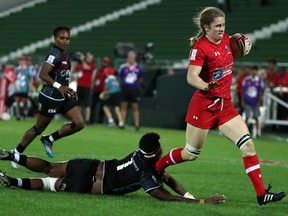Canada's Emma Chown evades a tackle attempt by Fiji's Merewai Cumu during the World Rugby Women's Sevens Series match in Dubai on Thursday.