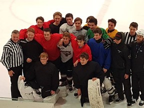 The Whistler Minor Hockey midget A1 team pose with Justin Bieber, who skated with them on Thursday.