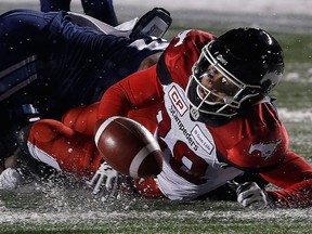Calgary Stampeders' Kamar Jorden fumbles during fourth-quarter Grey Cup action on Nov. 26, 2017. The CFL season will be extended by one week in a bid to reduce injuries.