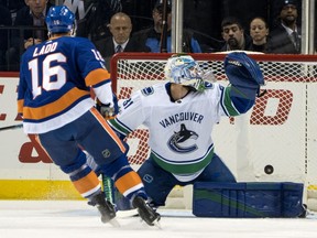 New York Islanders' Andrew Ladd scores as the puck gets past Vancouver Canucks' goalie Andres Nilsson during the first period of an NHL hockey game Tuesday, Nov. 28, 2017, in New York. (AP Photo/Craig Ruttle) ORG XMIT: NYCR103
Craig Ruttle, AP