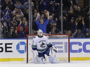 Vancouver Canucks goalie Jacob Markstrom reacts after New York Rangers' Jimmy Vesey scored the winning goal during the shoot-out of the NHL hockey game, Sunday, Nov. 26, 2017, in New York. The Rangers defeated the Canucks in a shoot-out 4-3.