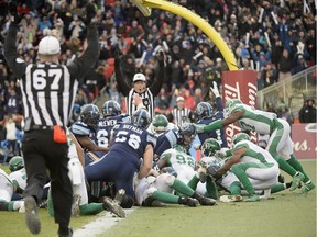 Toronto Argonauts backup quarterback Cody Fajardo breaks the plane for a touchdown with less than a minute left in the fourth quarter of Sunday’s CFL East Division final, as the host Argos beat the Saskatchewan Roughriders 25-21 to advance to next week’s Grey Cup championship game.