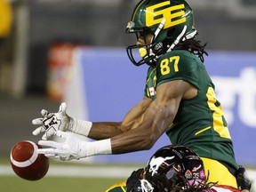 In this Oct. 28 file photo, Edmonton Eskimos receiver Derel Walker (87) bobbles the ball against the Calgary Stampeders.