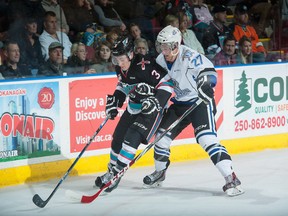 Jared Dmytriw of the Victoria Royals checks Riley Stadel of the Kelowna Rockets during the first period of an Oct. 9, 2015 game. The Giants landed Dmytriw in a trade with Red Deer on Tuesday.