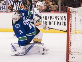 Jonathan Marchessault  of the Vegas Golden Knights watches the puck slide across the goal line after beating goalie Jacob Markstrom  of the Vancouver Canucks with a shot during Thursday's game at Rogers Arena.