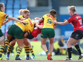 Kelcey Leavitt of Canada is up ended in a tackle during the Women's Rugby League World Cup match between the Canadian Ravens  and the Australian Jillaroos at Southern Cross Group Stadium on November 22, 2017 in Sydney, Australia.