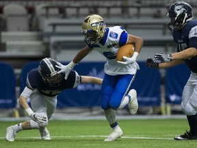 GW Graham Grizzlies Von Richardson closes in on Seaquam Seahawks Tyson Philpot as he pushes off Grizzzlies in the double-semifinal playoff game during the BC High School Football championships at B.C. Place last year.