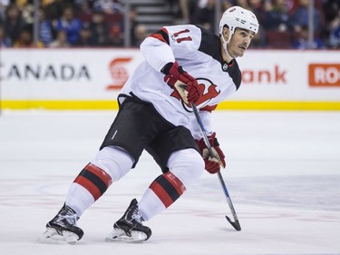 New Jersey Devils' Brian Boyle skates during the first period of an NHL hockey game against the Vancouver Canucks on Wednesday. Boyle is playing in his first game of the season after being diagnosed with cancer.