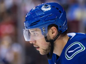 Vancouver Canucks' Derrick Pouliot lines up for a faceoff during third period NHL hockey action against the Calgary Flames, in Vancouver on Saturday, October 14, 2017.
