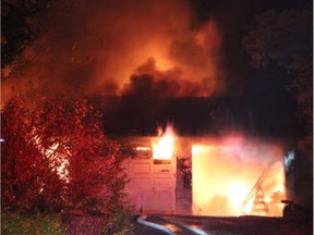 Fire crews battle a massive house fire in Surrey early Friday morning. All six members of the same family escaped unharmed.
