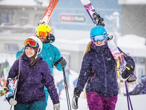 Group of friends getting ready for their first run on Whistler mountain.