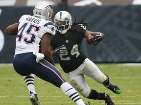 Oakland Raiders running back Marshawn Lynch (24) rushes against New England Patriots linebacker David Harris (45) during the second half of an NFL football game Sunday, Nov. 19, 2017, in Mexico City.