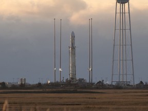 This photo provided by NASA shows the Orbital ATK Antares rocket, with the Cygnus spacecraft onboard, is seen on launch Pad-0A, Saturday, Nov. 11, 2017 at NASA's Wallops Flight Facility in Wallops Island, Va. The supply run to the International Space Station has been delayed a day by a stray plane which flew into the restricted airspace prompting NASA's commercial shipper, Orbital ATK, to call off the liftoff. (Bill Ingalls/NASA via AP)