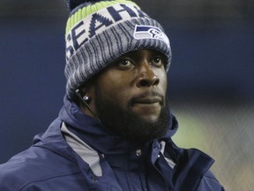 FILE - In this Nov. 20, 2017, file photo, injured Seattle Seahawks strong safety Kam Chancellor stands on the sidelines late in the second half of an NFL football game against the Atlanta Falcons, in Seattle. The Seahawks will be without strong safety Kam Chancellor for the rest of the season due to a neck injury he suffered earlier this month, coach Pete Carroll said Monday, Nov. 27, 2017. (AP Photo/Ted S. Warren, File)
