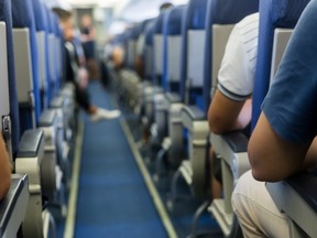 Interior of airplane with passengers on seats waiting to takeoff. (verve231/Getty Images)