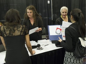 People at a job fair in Vancouver, where 43 per cent of workers are now immigrants.